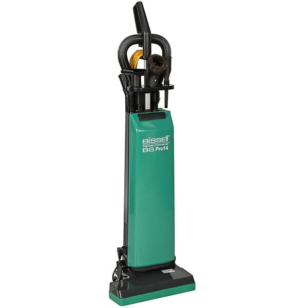 A green and black Bissell Commercial upright vacuum cleaner.