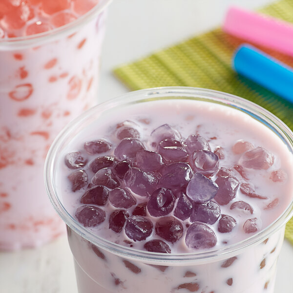 A cup of milk with purple Taro Crystal Boba.