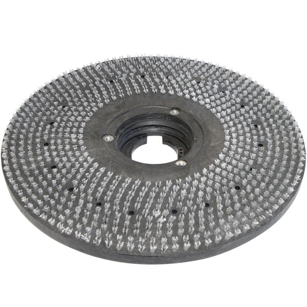 A circular metal Bissell Commercial pad driver with white bristles.