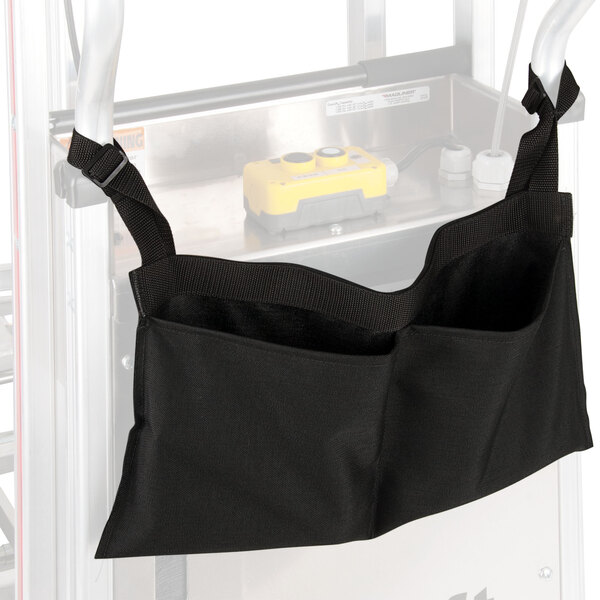 A black bag hanging from a metal Magliner hand truck.