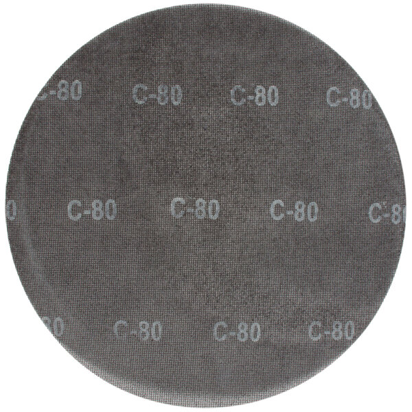 A circular Bissell Commercial sand screen disc with white text reading "60 Grit"