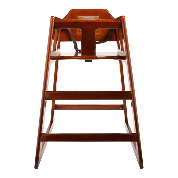 A wooden high chair with a seat and back.