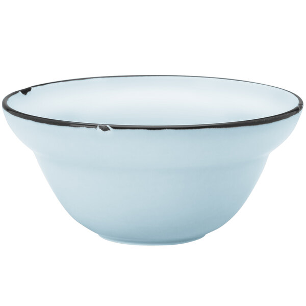 A white porcelain bowl with a black and blue rim.