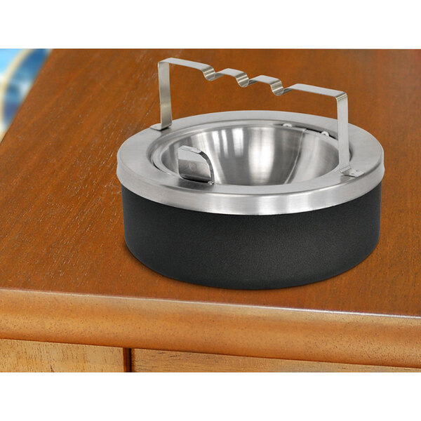 A black and silver Ex-Cell Kaiser large capacity tabletop ashtray with a metal handle.