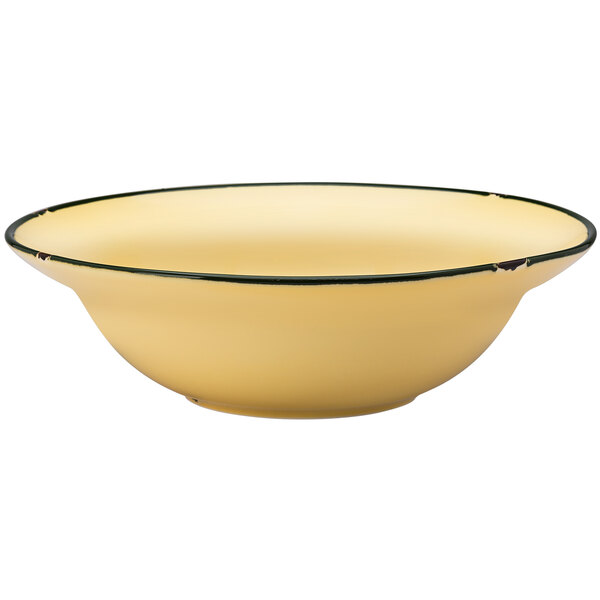 A close up of a yellow Luzerne Tin Tin porcelain bowl with a black rim.
