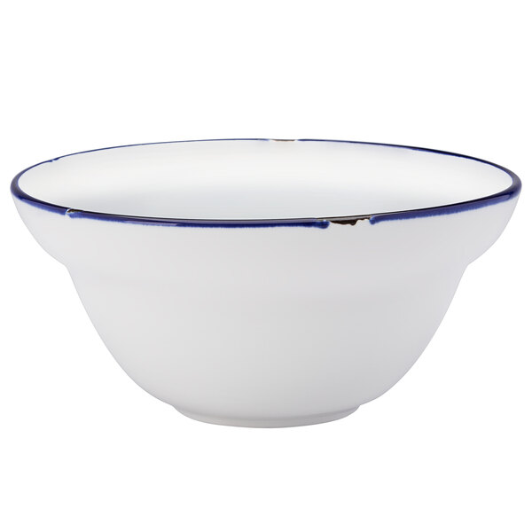 A white Luzerne Tin Tin porcelain soup bowl with a blue rim.