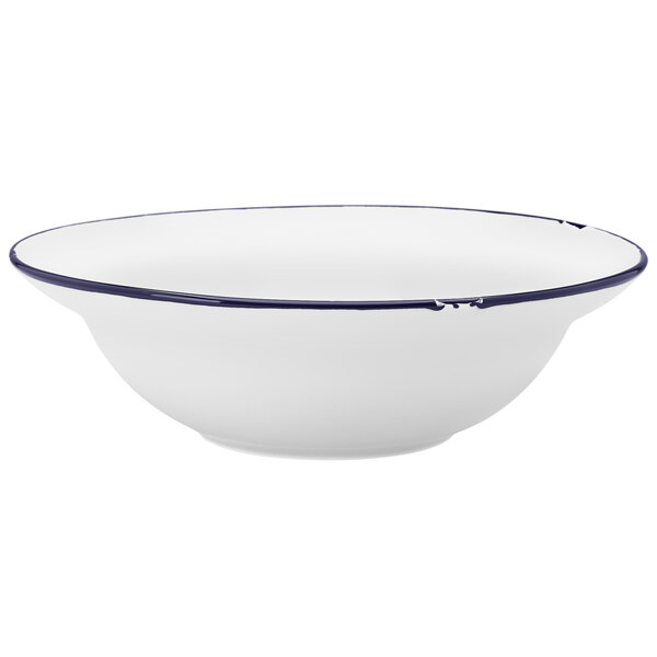 A white Luzerne porcelain entree bowl with a blue rim.