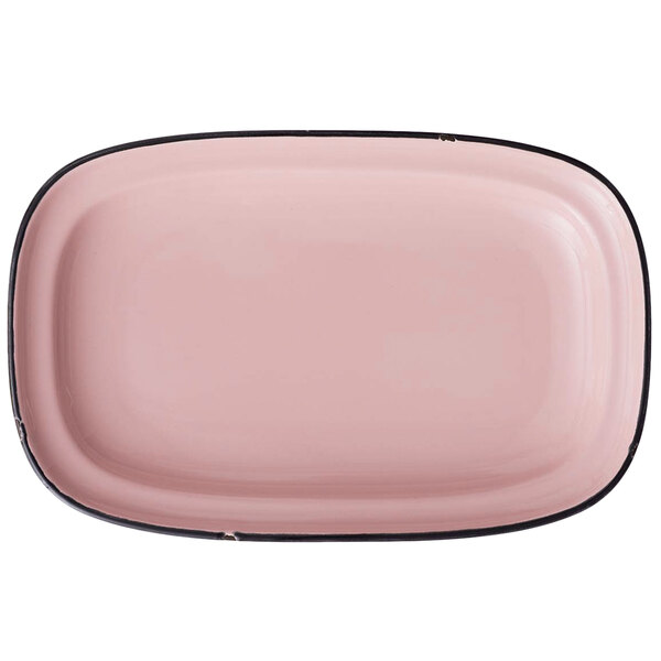 A pink rectangular porcelain platter with black trim.
