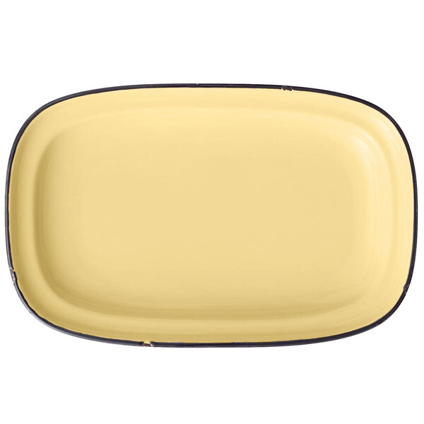 A yellow rectangular porcelain platter with black trim.