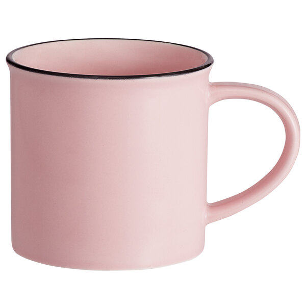 A pink Luzerne Tin Tin porcelain coffee mug with a black rim.