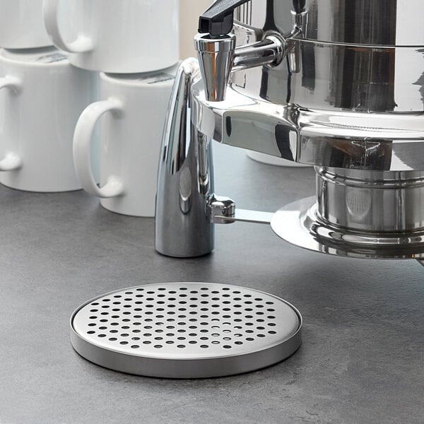 An American Metalcraft stainless steel drip tray under a coffee machine on a counter.