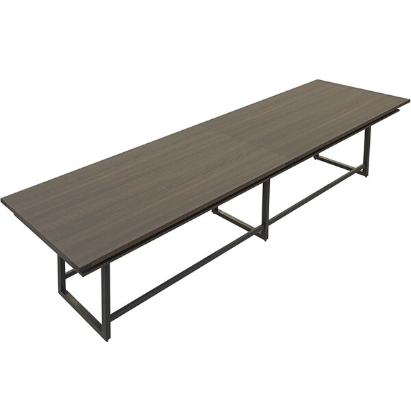 A Safco Mirella rectangular conference table with a brown wood top and metal legs.