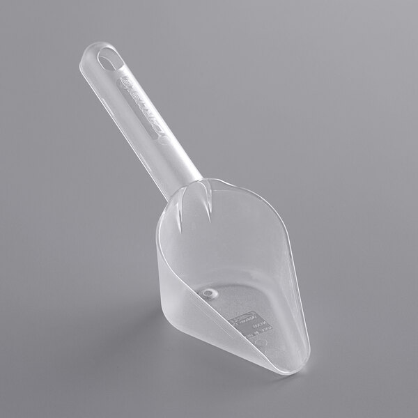 A Carlisle clear plastic utility scoop with a long handle.
