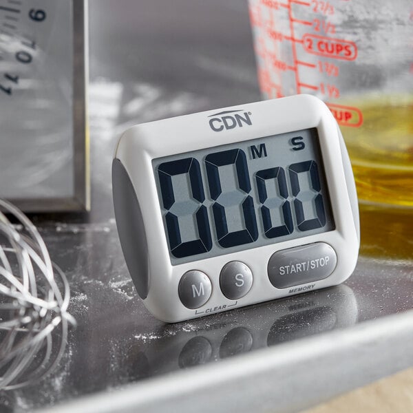 A CDN digital kitchen timer on a counter.