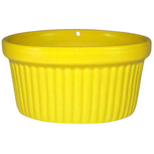 A yellow International Tableware stoneware fluted ramekin.