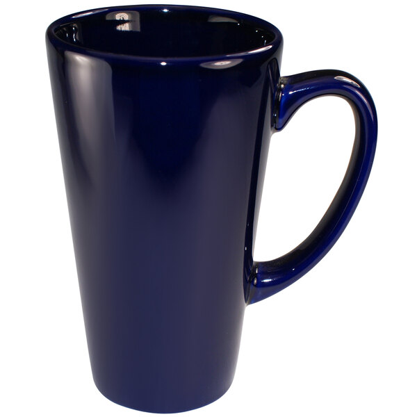 A cobalt blue stoneware funnel cup with a handle.