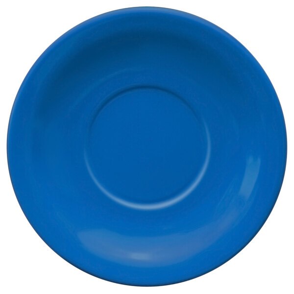 A light blue stoneware saucer with a circle in the middle.