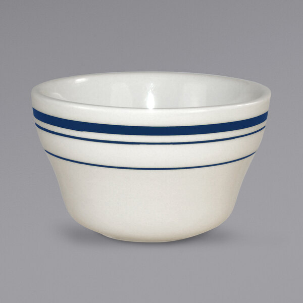An ivory stoneware bowl with blue stripes.