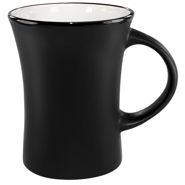 A black stoneware mug with a white rim and flared venturi design and a handle.