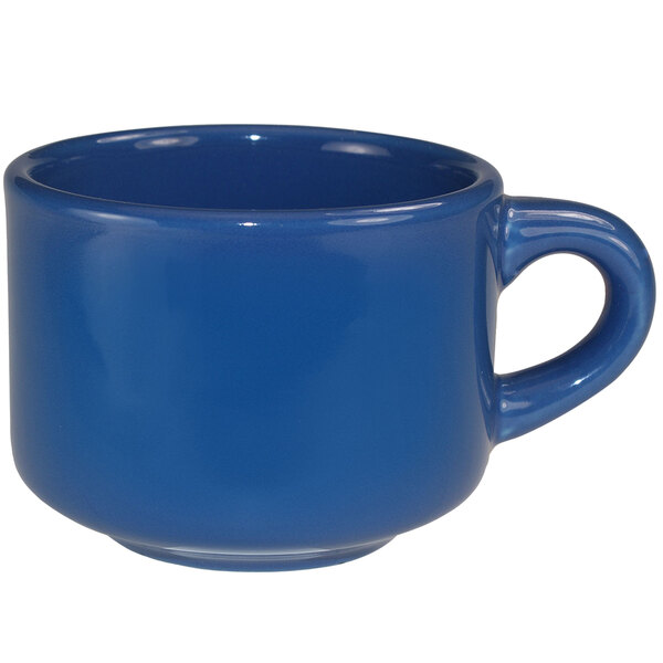 A light blue International Tableware stoneware coffee cup with a handle.
