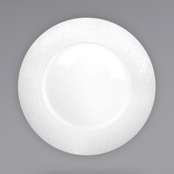 A white porcelain plate with a textured white rim.