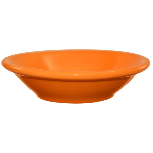 An International Tableware orange stoneware bowl.
