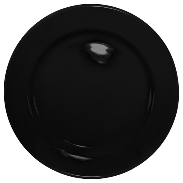 A black International Tableware stoneware plate with a wide rim.