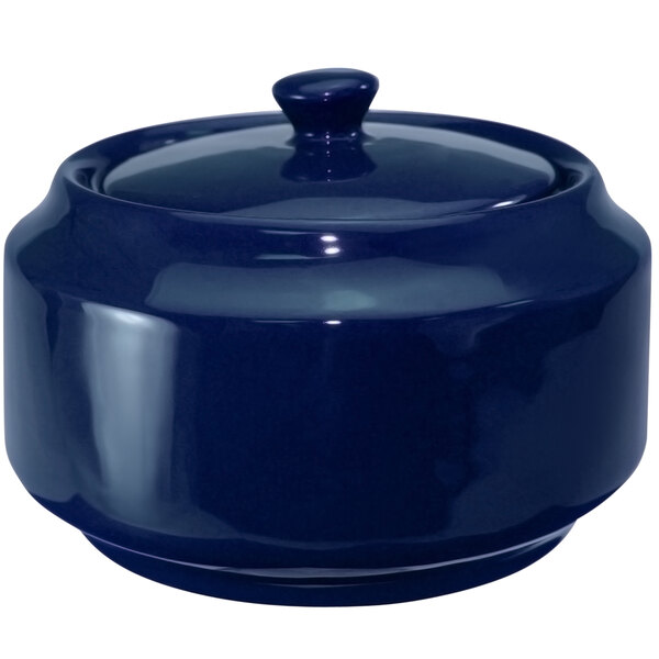 A cobalt blue ceramic sugar bowl with a lid.