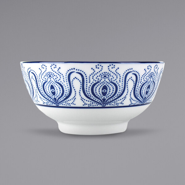 A white stoneware bowl with a blue design.
