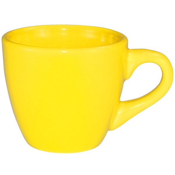 A close-up of a yellow International Tableware Cancun stoneware espresso cup with a handle.