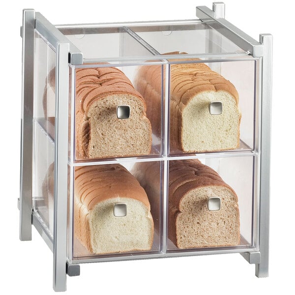 A glass case with four drawers holding sliced bread.