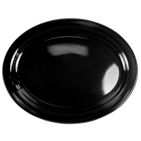 A black oval platter with a curved surface.