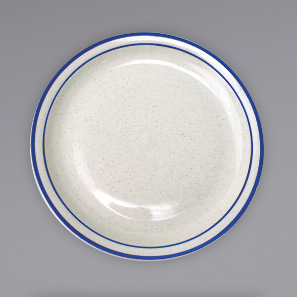 An International Tableware Danube ivory stoneware plate with a blue rim.