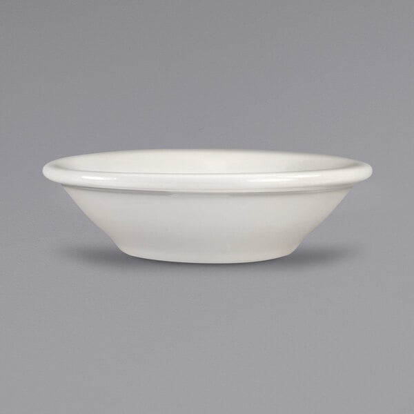 An ivory stoneware bowl with a rolled edge.