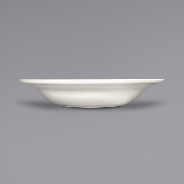 A close up of a International Tableware Roma stoneware bowl with a rolled edge.