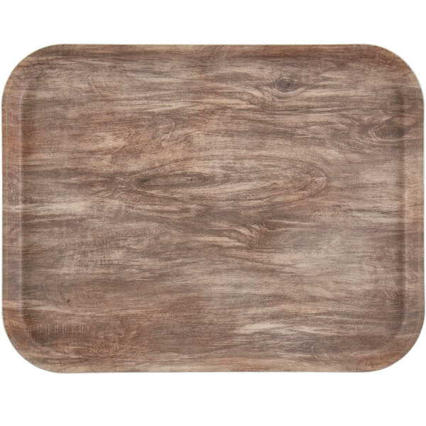 A rectangular light oak Cambro EpicTread tray with a non-skid surface.