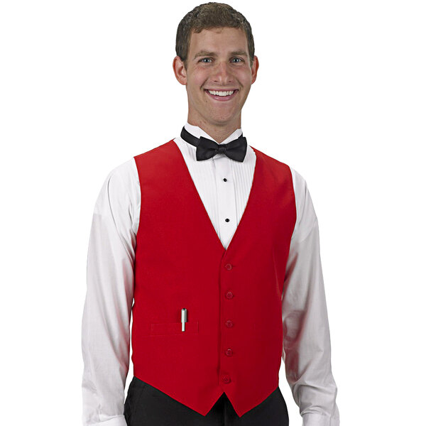 A man wearing a red Henry Segal server vest and bow tie.