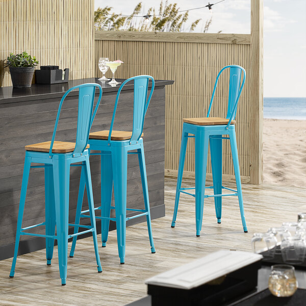 Lancaster Table & Seating Alloy Series Arctic Blue Metal Indoor Industrial Cafe Bar Height Stool with Vertical Slat Back and Natural Wood Seat