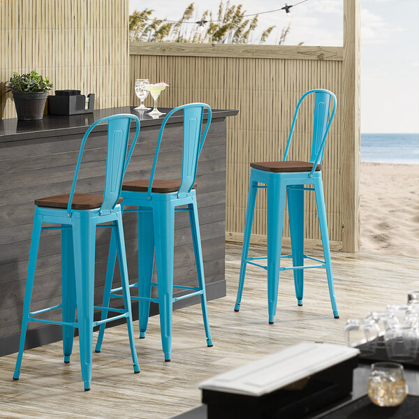 Lancaster Table & Seating Alloy Series Arctic Blue Metal Indoor Industrial Cafe Bar Height Stool with Vertical Slat Back and Walnut Wood Seat