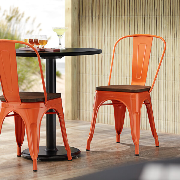 Lancaster Table & Seating Alloy Series Orange Metal Indoor Industrial Cafe Chair with Vertical Slat Back and Walnut Wood Seat