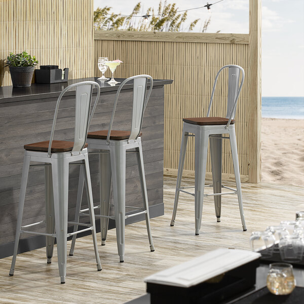 Lancaster Table & Seating Alloy Series Silver Metal Indoor Industrial Cafe Bar Height Stool with Vertical Slat Back and Walnut Wood Seat
