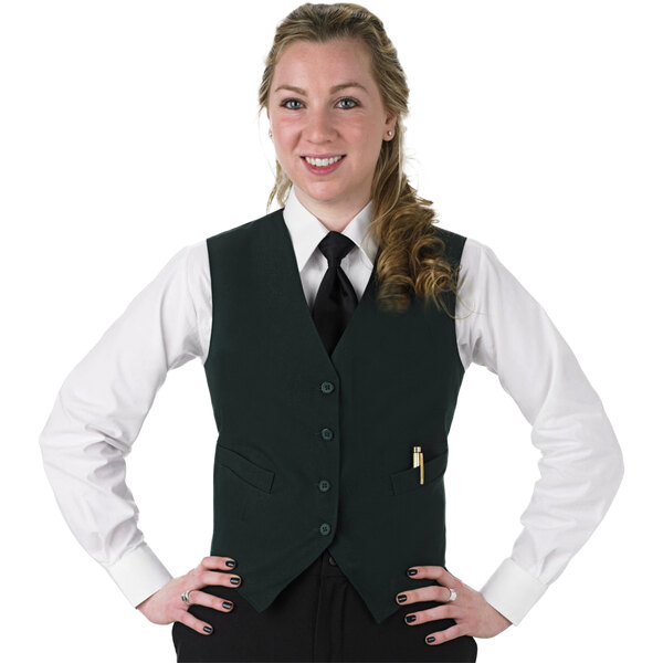 A woman wearing a Henry Segal hunter green server vest and tie.