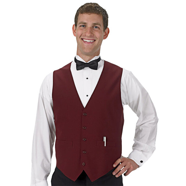 A man wearing a Henry Segal burgundy server vest and bow tie.