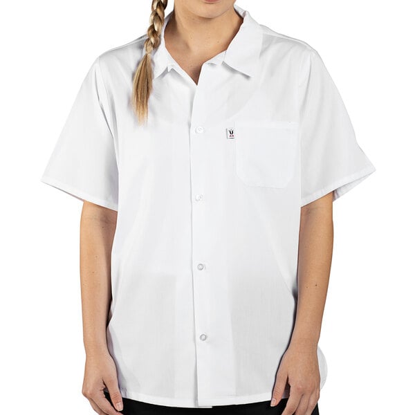 A woman wearing a white Uncommon Chef cook shirt with a braid.