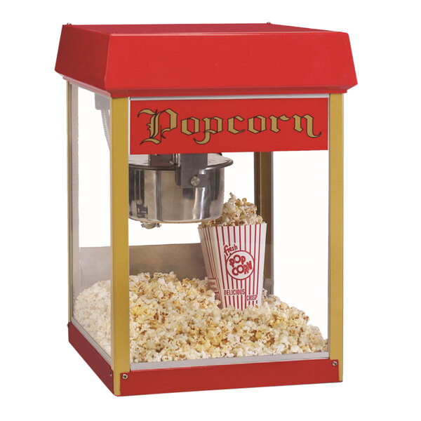 A red and white Global Solutions by Nemco popcorn machine.