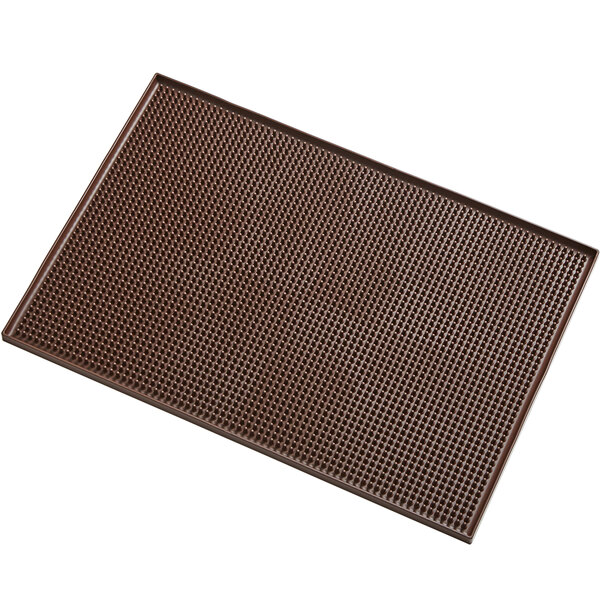 A brown rectangular American Metalcraft bar mat with holes.