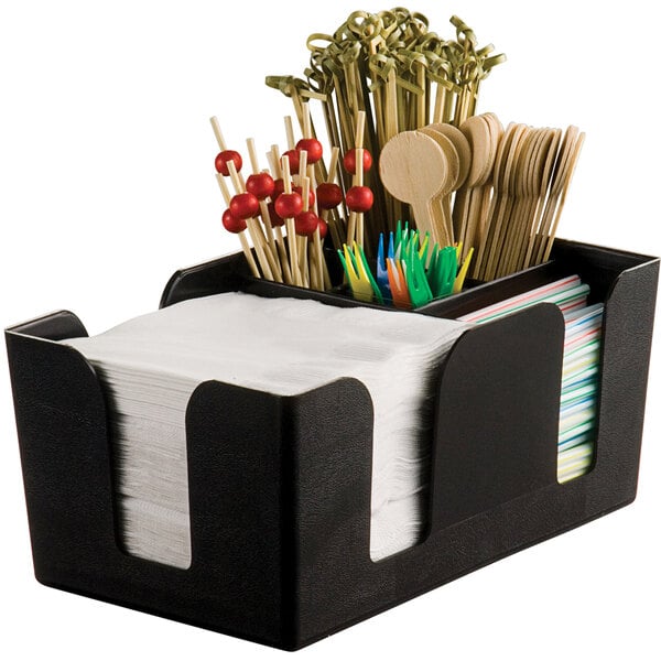An American Metalcraft black plastic bar caddy with napkins and wooden spoons.