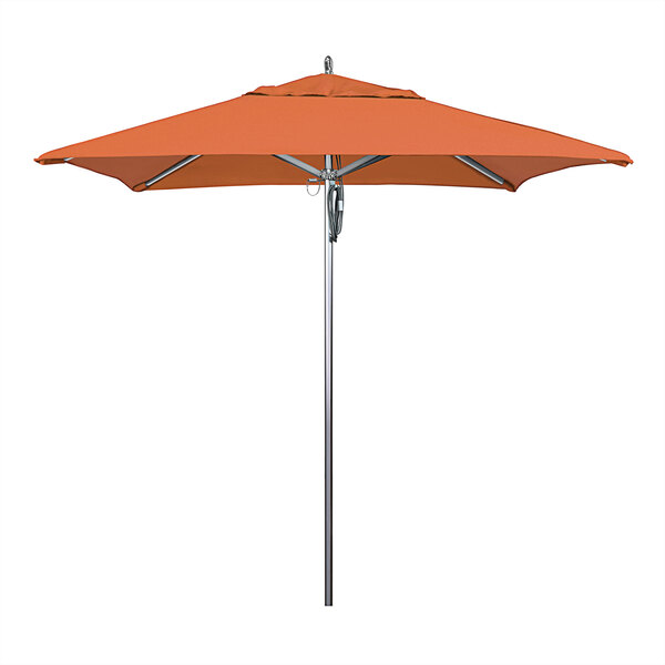 An orange California Umbrella on a metal pole with a Sunbrella Tuscan canopy.