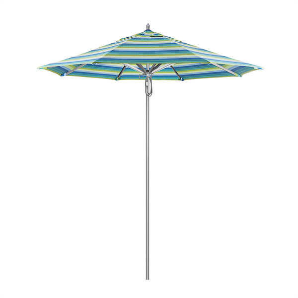 A California Umbrella with blue and yellow stripes on a metal pole with Seville Seaside fabric.