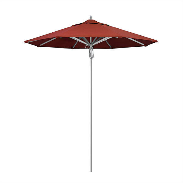 A California Umbrella with a terracotta Sunbrella canopy on an aluminum pole.